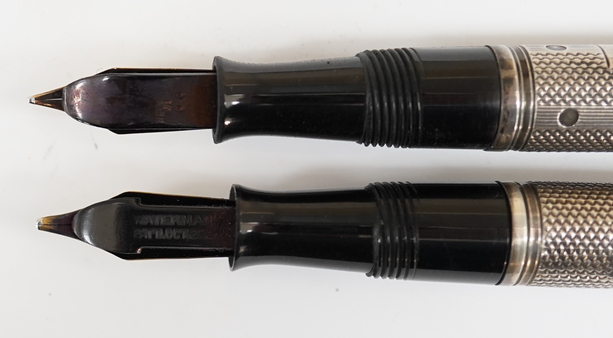 Two Waterman Sterling silver fountain pens, fully hallmarked with FDW maker's mark lever filled pens